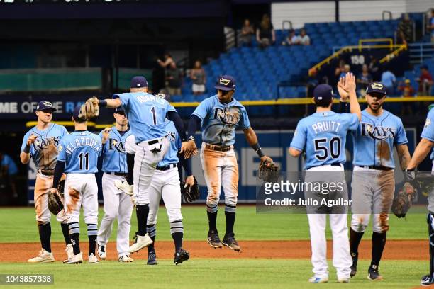 Willy Adames and Mallex Smith of the Tampa Bay Rays celebrate after a 9-4 win over the Toronto Blue Jays on September 30, 2018 at Tropicana Field in...