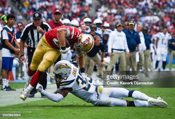 Tight end George Kittle of the San Francisco 49ers makes a first down catch against the Los Angeles Chargers at StubHub Center on September 30, 2018...
