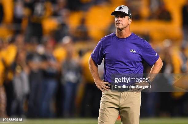 Head coach John Harbaugh of the Baltimore Ravens looks on during warmups before the game against the Pittsburgh Steelers at Heinz Field on September...
