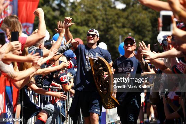 Boyd Cordner and Jake Friend of the Sydney Roosters arrive with the Provan-Summons Trophy for their fan day celebrations after winning yesterday's...