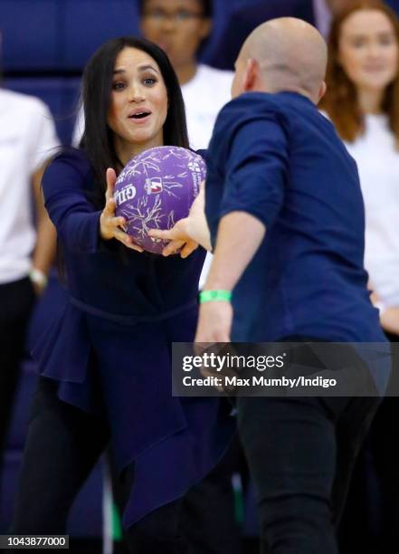 Meghan, Duchess of Sussex takes part in a netball game as she attends the Coach Core Awards held at Loughborough University on September 24, 2018 in...