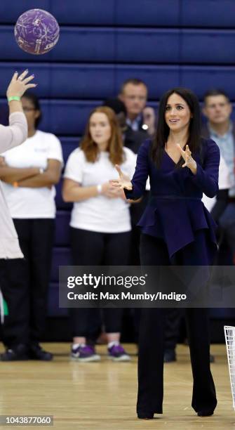 Meghan, Duchess of Sussex takes part in a netball game as she attends the Coach Core Awards held at Loughborough University on September 24, 2018 in...