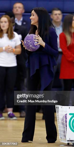 Meghan, Duchess of Sussex takes part in a netball game as she attends the Coach Core Awards held at Loughborough University on September 24, 2018 in...