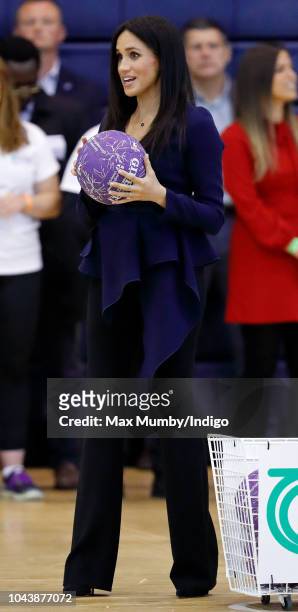 Meghan, Duchess of Sussex takes part in a netball game as she attends the Coach Core Awards held at Loughborough University on September 24, 2018 in...
