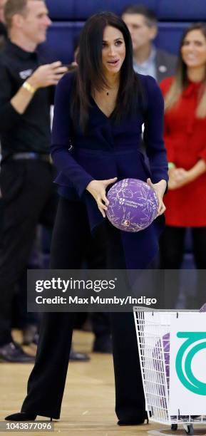 Meghan, Duchess of Sussex takes part in a netball game as she attends the Coach Core Awards held at Loughborough University on September 24, 2018 in...