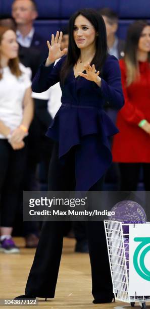 Meghan, Duchess of Sussex takes part in a netball game as she attends the Coach Core Awards held at Loughborough University on September 24, 2018 in...