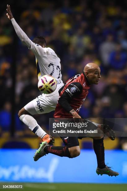 Clemente Rodriguez of Colon fights for the ball with Sebastian Villa of Boca Juniors during a match between Boca Juniors and Colon as part of...