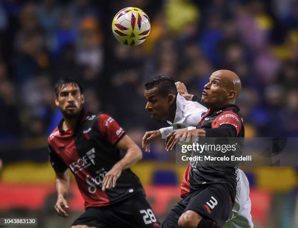 Clemente Rodriguez of Colon fights for the ball with Sebastian Villa of Boca Juniors during a match between Boca Juniors and Colon as part of...