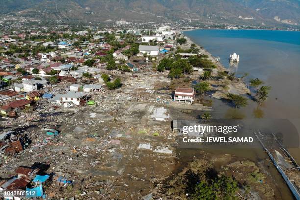 An aerial view shows the earthquake and tsunami devasted neighbourhood in Palu, Indonesia's Central Sulawesi on October 1, 2018. The death toll from...
