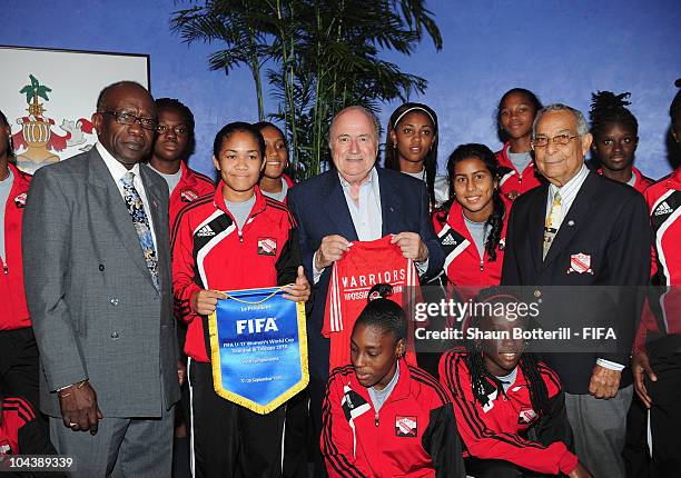 President Joseph S. Blatter, FIFA Vice President Jack Warner and Oliver Camps Chairman LOC pose with Trindad & Tobago U17 Women's team members at...