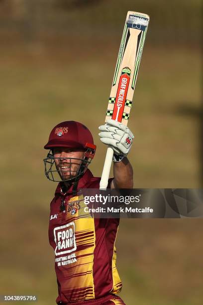 Chris Lynn of the Bulls celebrates scoring a century during the JLT One Day Cup match between New South Wales and Queensland at Drummoyne Oval on...