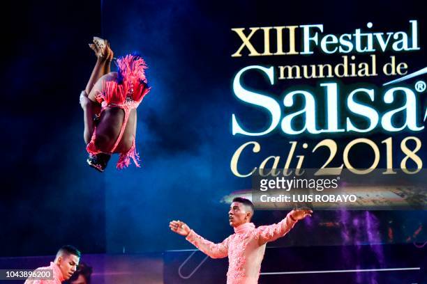 Members of Colombia's "Vueva Constelacion" dance group participate in the cabaret groups professional category during the XIII World Salsa Festival...