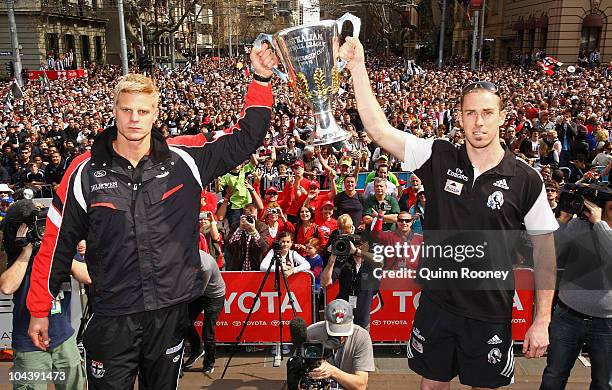 Saints captain Nick Riewoldt and Magpies captain Nick Maxwell hold the premiership cup aloft during the AFL Grand Final Parade on September 24, 2010...