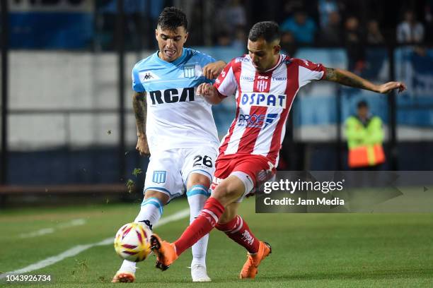 Renzo Saravia of Racing Club fights for the ball with Damian Martinez of Union during a match between Racing Club and Union as part of Superliga...