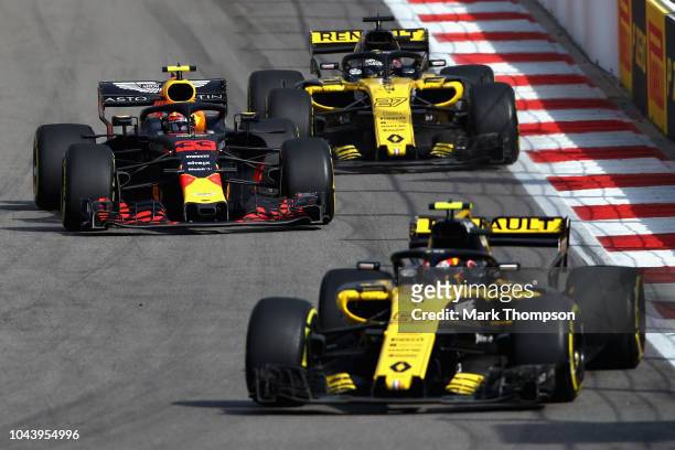 Max Verstappen of the Netherlands driving the Aston Martin Red Bull Racing RB14 TAG Heuer overtakes Nico Hulkenberg of Germany driving the Renault...