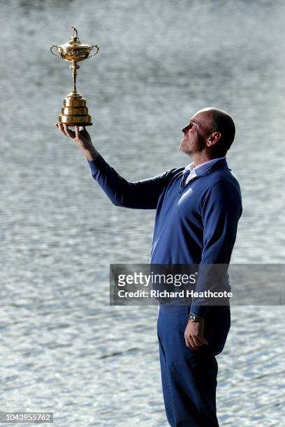 Captain Thomas Bjorn of Europe pose for a photo with The Ryder Cup during a press conference following Europe's win in the 2018 Ryder Cup at Le Golf...