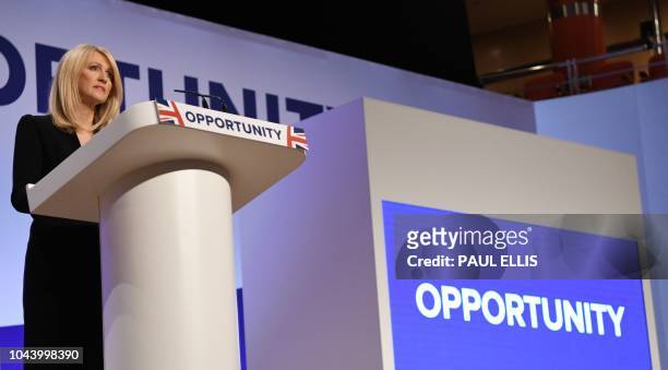 Britain's Work and Pensions Secretary Esther McVey gives a speech in the main hall on the second day of the Conservative Party Conference 2018 at the...