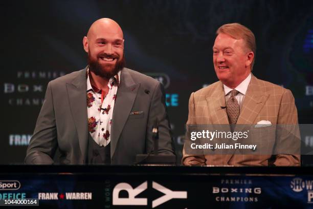 Tyson Fury of England and his promoter Frank Warren reacts during a press conference ahead of the match between Tyson Fury and Deontay Wilde on...