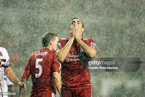 Sotiros Kyrgiakos of Liverpool holds his head after a shot had gone wide of the goal during the Carling Cup Third Round match between Liverpool and...