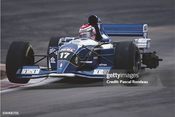 Andrea Montermini drives the Pacific Grand Prix Pacific PR02 Ford without the left rear wheel back to the pits during practice for the European Grand...