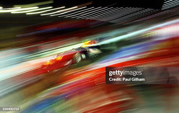 Mark Webber of Australia and Red Bull Racing drives during practice for the Singapore Formula One Grand Prix at the Marina Bay Street Circuit on...