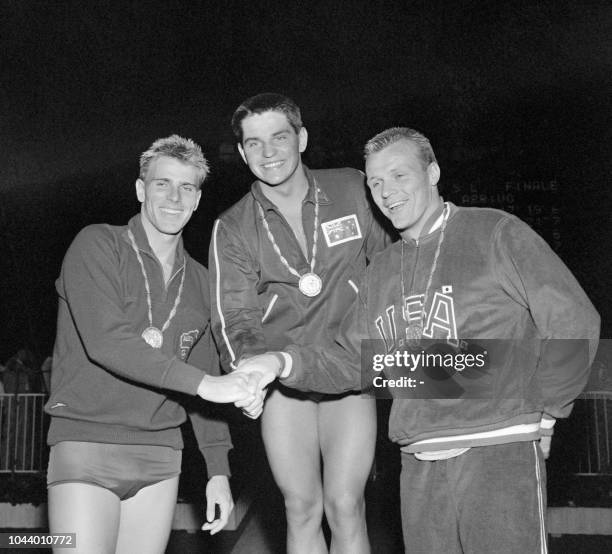 The three Australian winners of the 1.500 m freestyle, Murray Rose , Jon Konrads and Breen congratulate each other at the Olympic Games in Rome, 04...