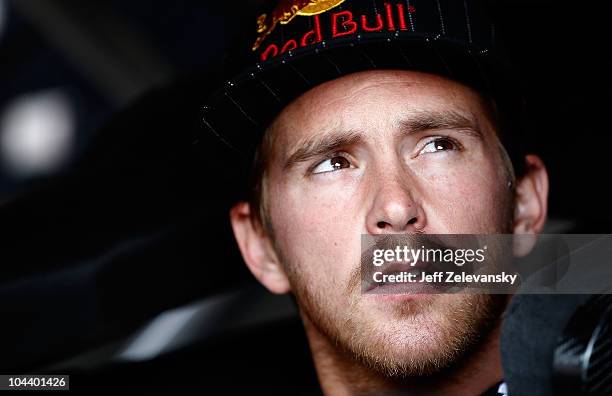 Scott Speed, driver of the Red Bull Toyota, sits in his car prior to practice for the NASCAR Sprint Cup Series AAA 400 at Dover International...