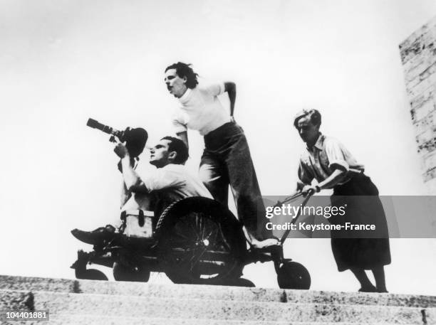The German film maker Leni RIEFENSTAHL and the cameraman Walter FRENTZ are filming THE GODS OF THE STADIUM during the Berlin Olympic Games. An...