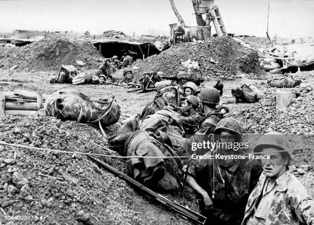 French soldiers who have been parachuted in as reinforcements are moving around in the trenches to take new positions during violent artillery...