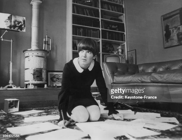 Mary QUANT, fashion designer and initiator of the mini-skirt, is seen in her flat in Dracott Place, Chelsea surrounded by fashion drawings as she...