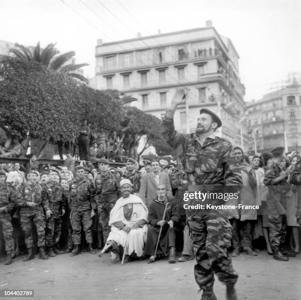 Algiers : Pierre LAGAILLARDE, one of the two leaders of the pro-French Algeria protesters, temporarily leaves the university building in which he has...