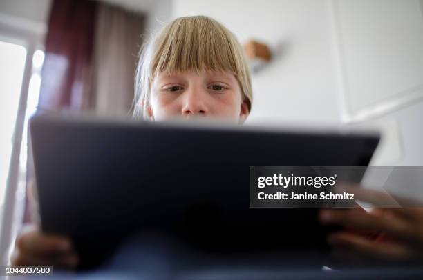 Young girl is using a tablet on August 14, 2018 in Berlin, Germany.