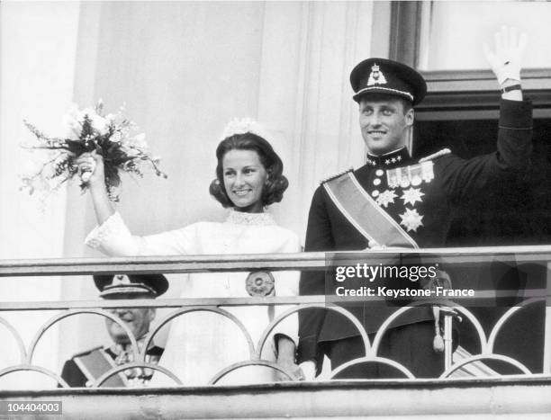 Prince HARALD and Princess SONJA greeting the crowd upon their wedding from the Royal Palace's balcony in Oslo, Norway.