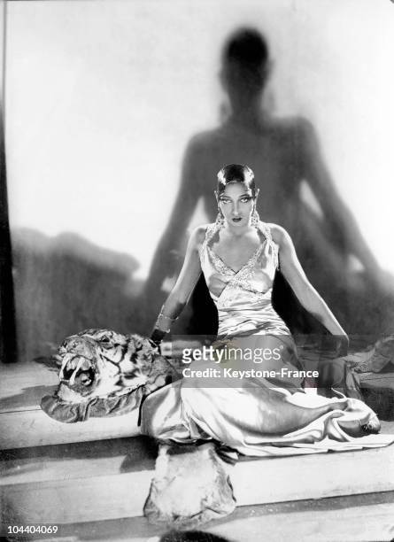 Studio portrait between 1925 and 1932 of the American music-hall artist Josephine BAKER in which she is seated on a tiger skin. It was during this...
