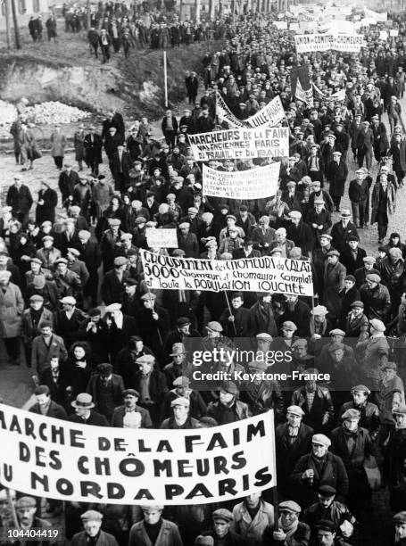 French unemployed people demonstrating against hunger and the lack of work in Saint-Denis during the world-wide economic crisis following the 1929...