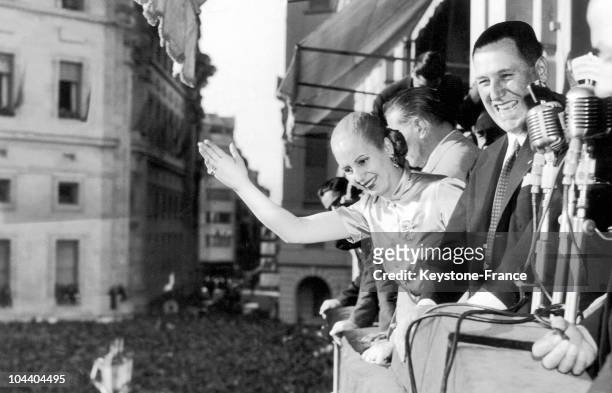 Upon the 5th anniversary of the Peronist movement in Buenos Aires, Argentinian President Juan PERON and his wife Eva PERON hail the crowd from the...