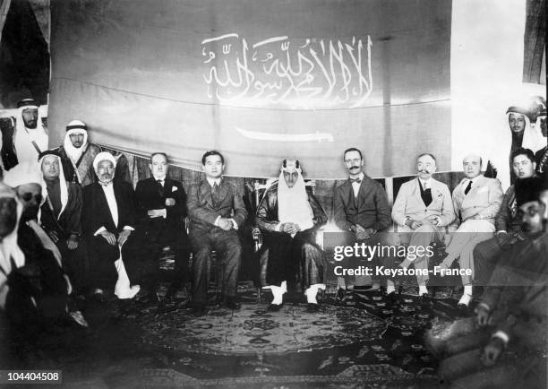 On the unification of the kingdom of Nadj and of Hedjaz in order to form Saudi Arabia. Prince FAYSAL of Hedjaz amongst Foreign Ambassadors who were...