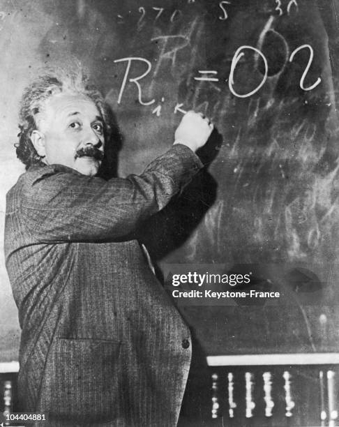 German-born theoretical physicist, Albert Einstein , writes a mathematical formula on a blackboard, 1931.