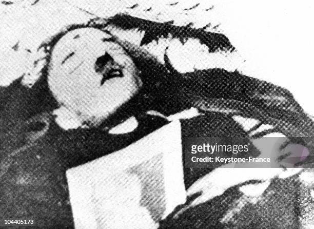 This is possibly a photograph of the mortal remains of the chancellor Adolf HITLER after he shot himself in the mouth in his bunker room in the...