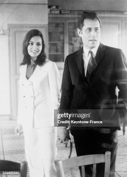 French actress Michele MERCIER and Claude BOURILLOT, an industrialist and President of the Automobile Sports Federation, holding hands in...