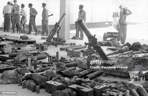 General view of some of the arms which belonged to the Cuban and American mercenary soldiers who landed at the Bay of Pigs in an attempt to overthrow...