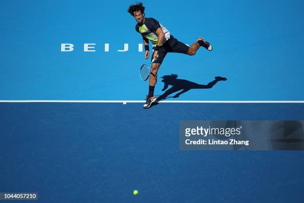 Feliciano Lopez of Spain hits a return against Borna Coric of Croatia during their Men's Singles 1nd Round match of the 2018 China Open at the China...