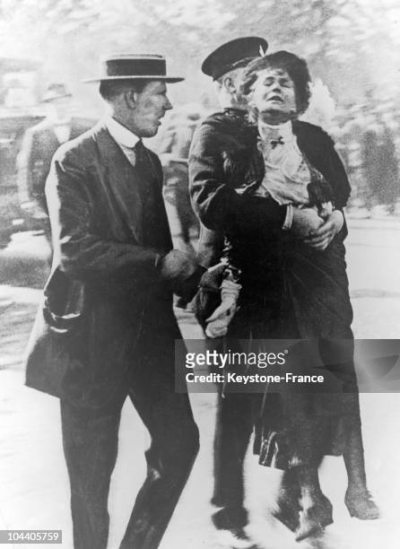 The British suffragette Emmeline GOULDEN PANKHURST being arrested by policemen in London, on August 21, 1914.