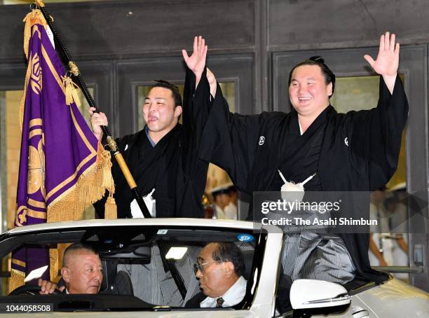 Mongolian yokozuna Hakuho celebrates in the victory parade after winning the tournament on day fifteen of the Grand Sumo Autumn Tournament at Ryogoku...