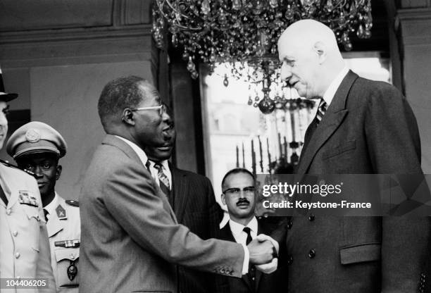 President DE GAULLE is shaking hands with Senegal president Leopold Sedar SENGHOR after a lunch at the Elysees Palace in Paris.