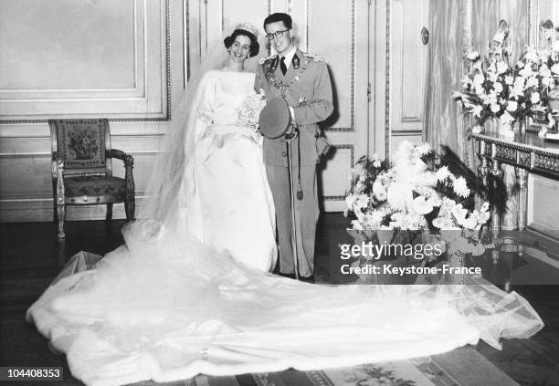 King BAUDOUIN 1st in his lieutenant general army uniform and DONA FABIOLA de MORA y ARAGON, wearing a wedding dress made by Cristobal BALENCIAGA,...