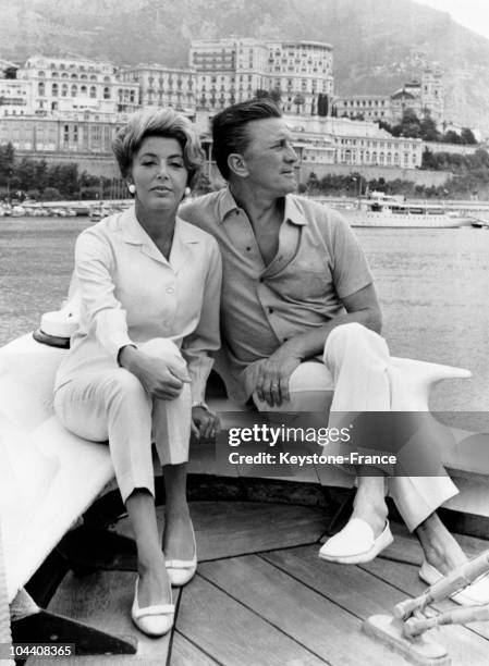 The actor Kirk DOUGLAS in Monte-Carlo with his wife, on the sailboat of the producer Sam SPIEGEL, after a short cruise in the Mediterranean.