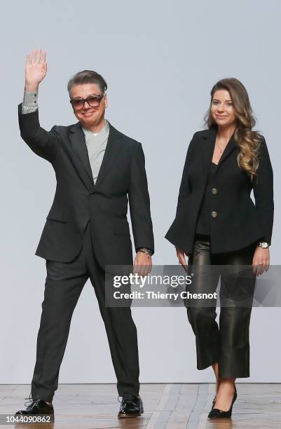 Fashion designers Valentin Yudashkin and Galina Yudashkina acknowledge the audience at the end of the Valentin Yudashkin show as part of the Paris...