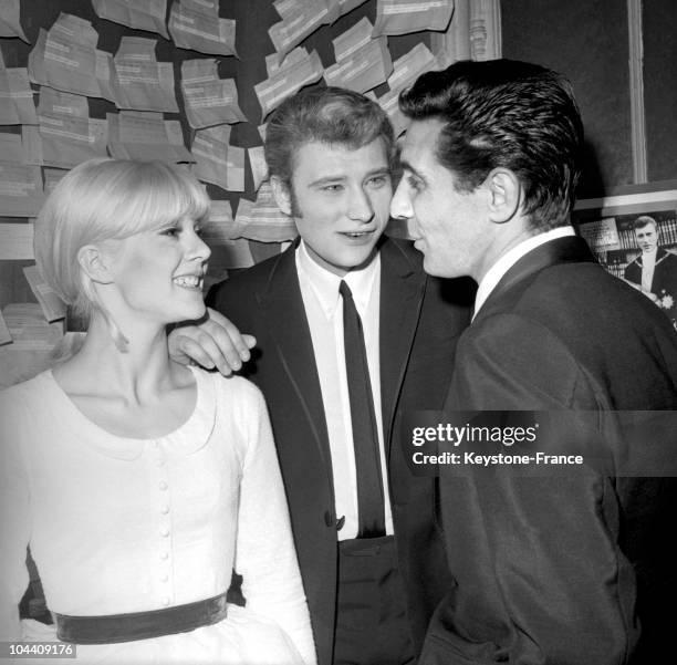 On November 26 the French singers Sylvie VARTAN and Gilbert BECAUD congratulate Johnny HALLYDAY in his dressing room at the Olympia, after his...