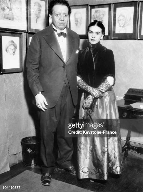 The Mexican couple, painters Diego RIVERA and Frida KAHLO attending an art exhibition in New York. Diego RIVERA, is a mural painter and militant in...